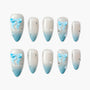 Blue ombre press-on nails with 3D bow and rhinestone accents, elegant and handmade design