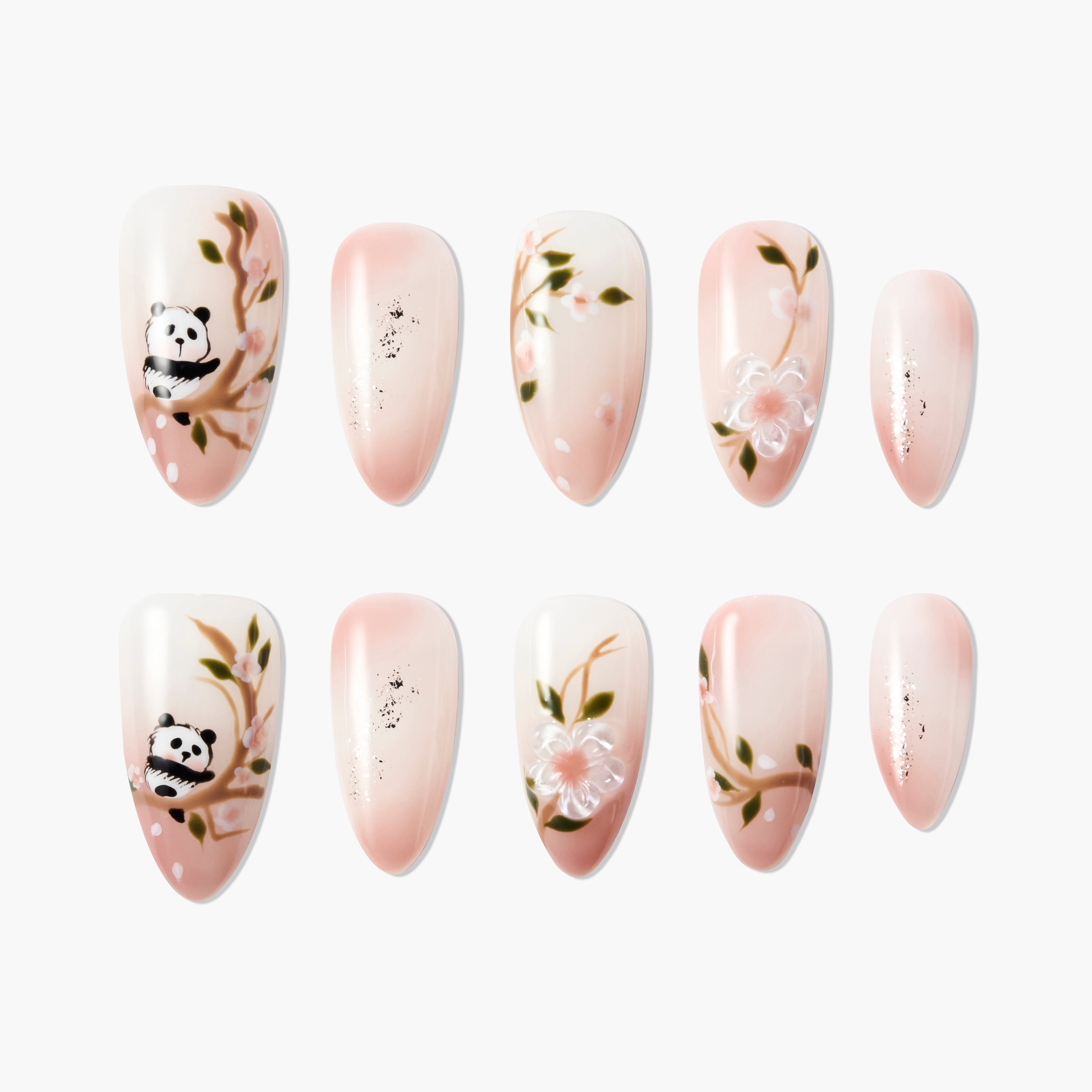 Handmade press-on nails with pink ombre, cherry blossom branches, panda art, and floral design