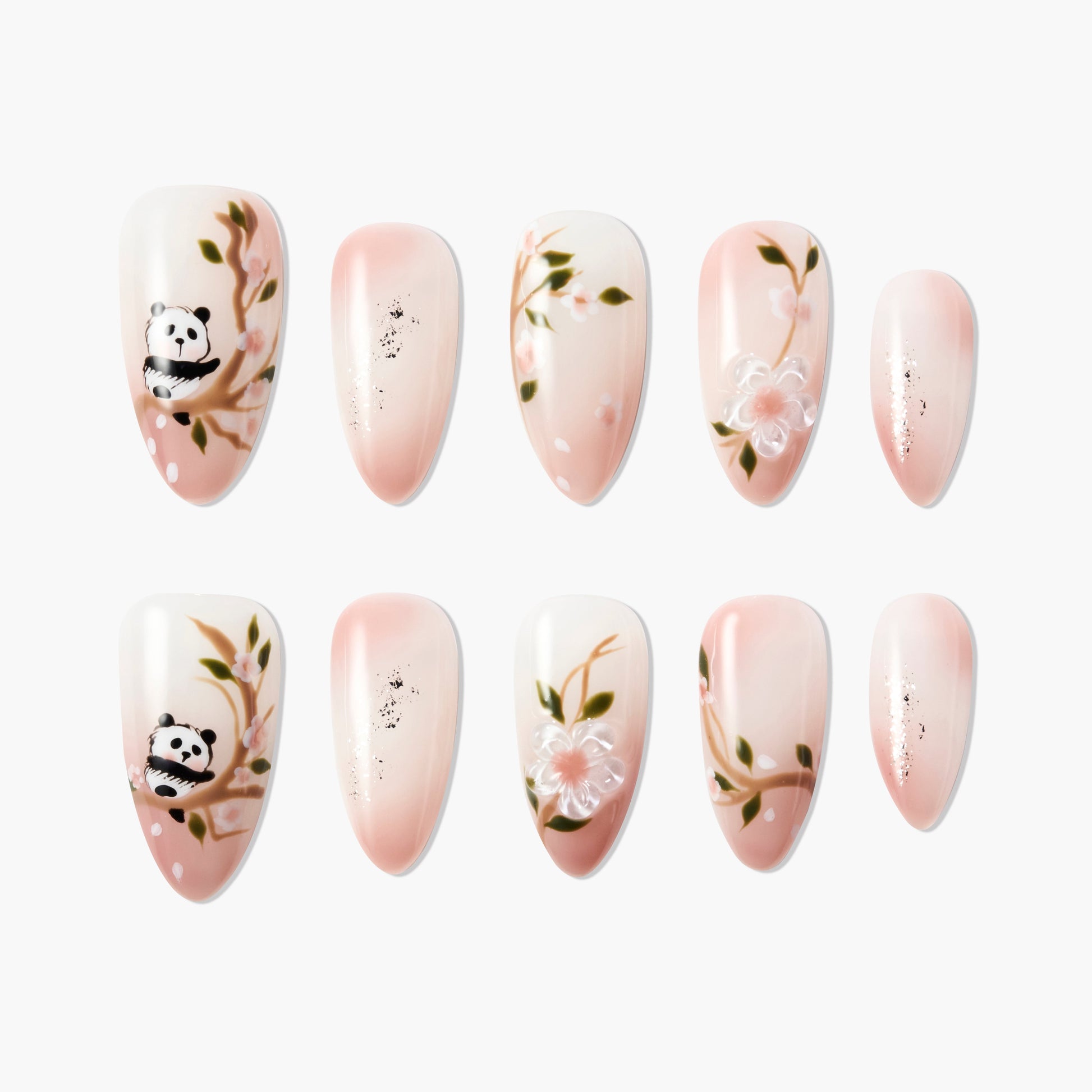 Handmade press-on nails with pink ombre, cherry blossom branches, panda art, and floral design