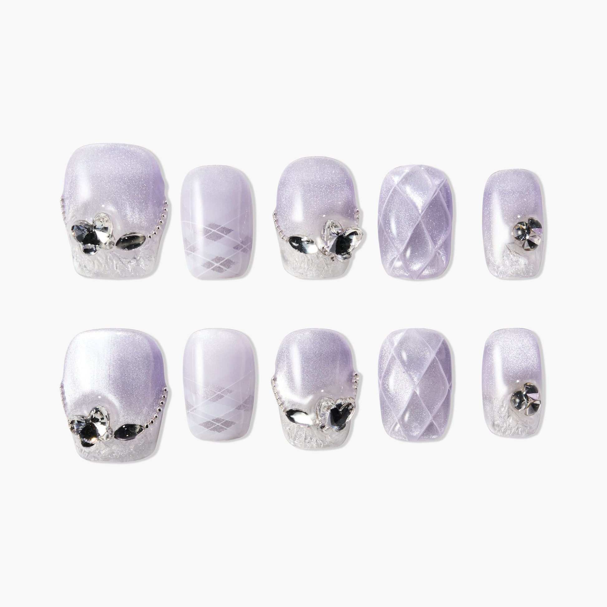 Lavender press-on nails with silver gems, argyle patterns, and quilted texture, glossy finish