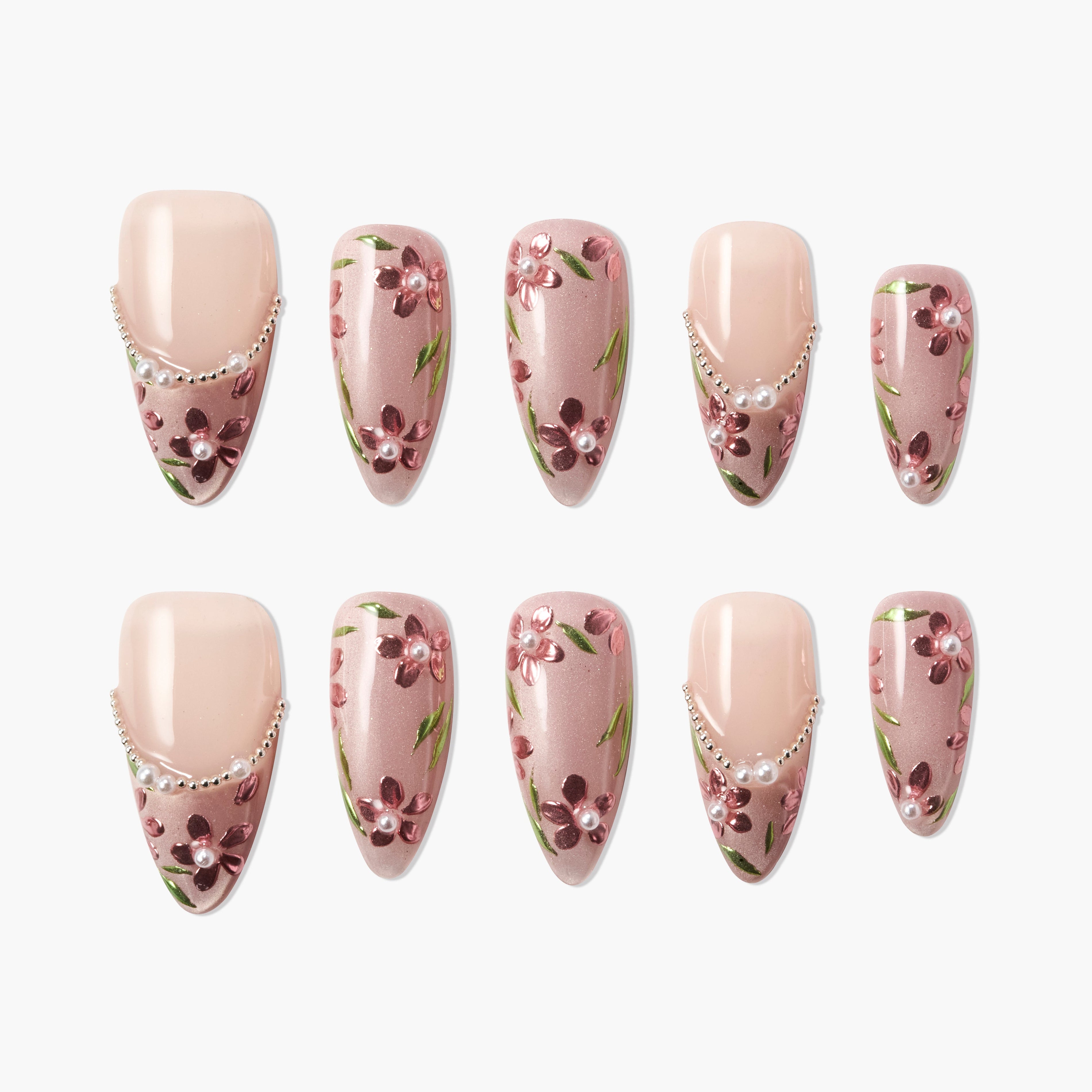 Handmade press-on nails with pink floral design, pearl accents, and nude base, arranged in a set.