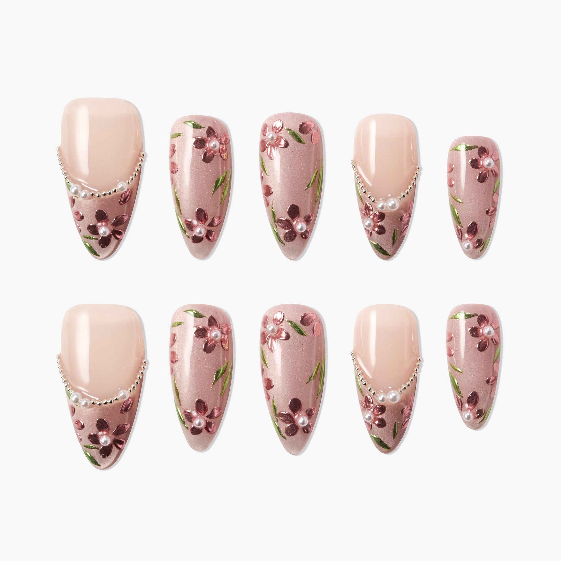 Handmade press-on nails with pink floral design, pearl accents, and nude base, arranged in a set.