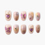Handmade press-on nails with pink, purple, and gold celestial and bow designs