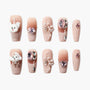 Handmade press-on nails with pink gemstones, 3D bows, and cute poodle dog designs