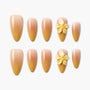 Ombre yellow nude press-on nails with 3D yellow flower accents, glossy finish