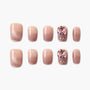 Nude pink press-on nails set with ombré finish and large pink crystal gem accents.