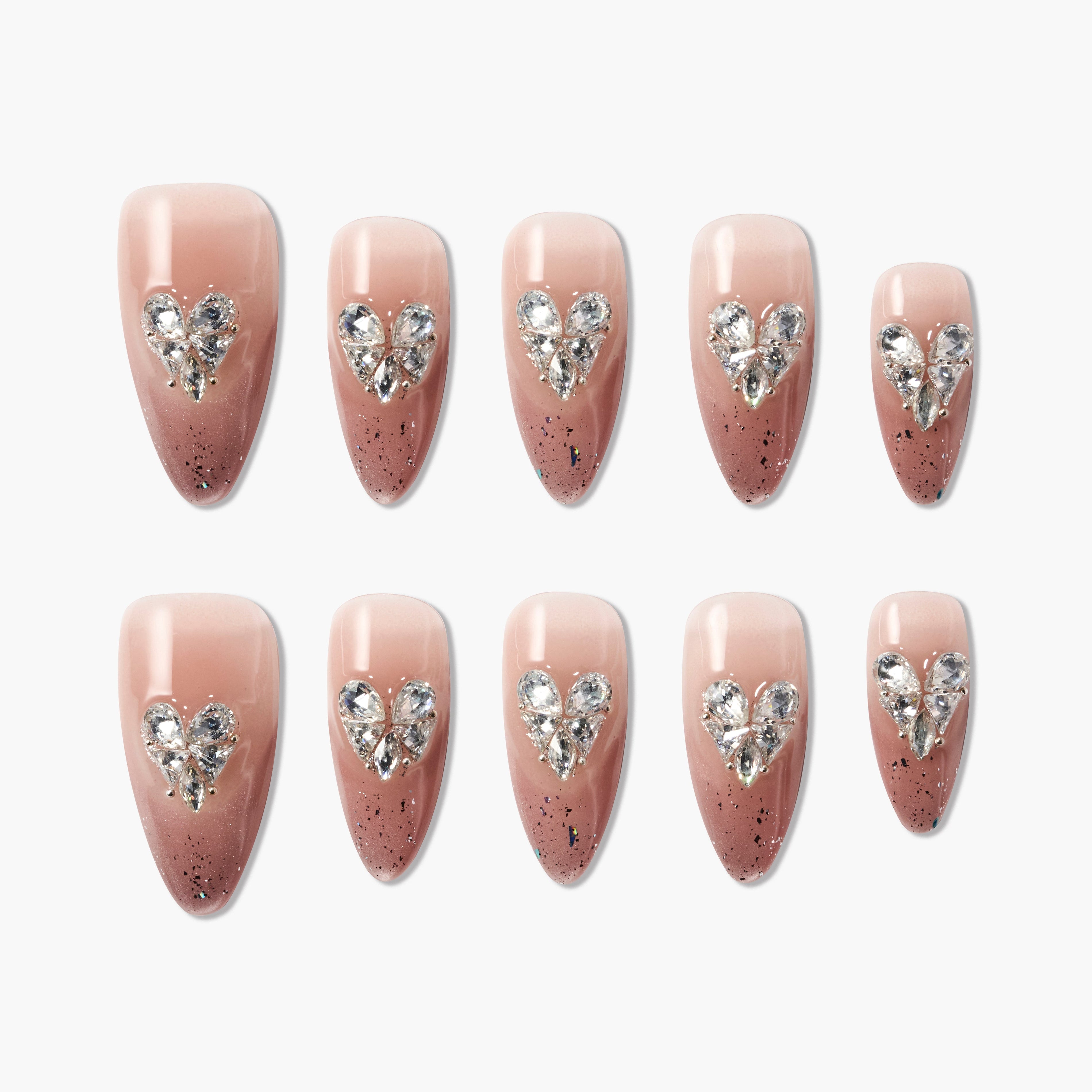Handmade pink and brown press-on nails with rhinestone heart accents and glitter tips