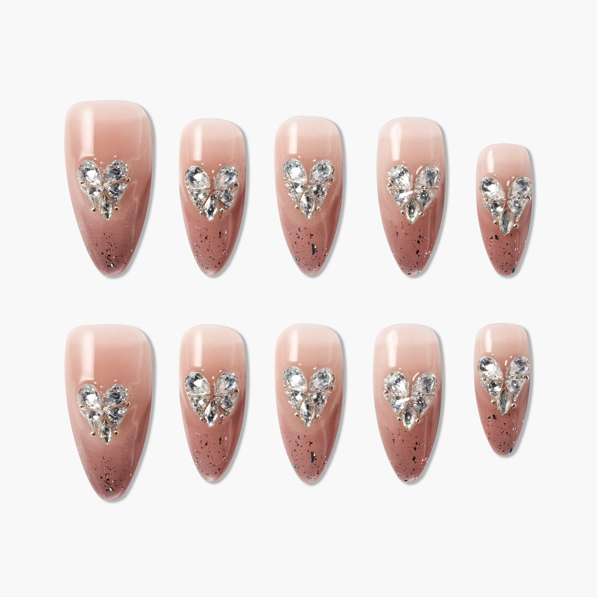 Handmade pink and brown press-on nails with rhinestone heart accents and glitter tips