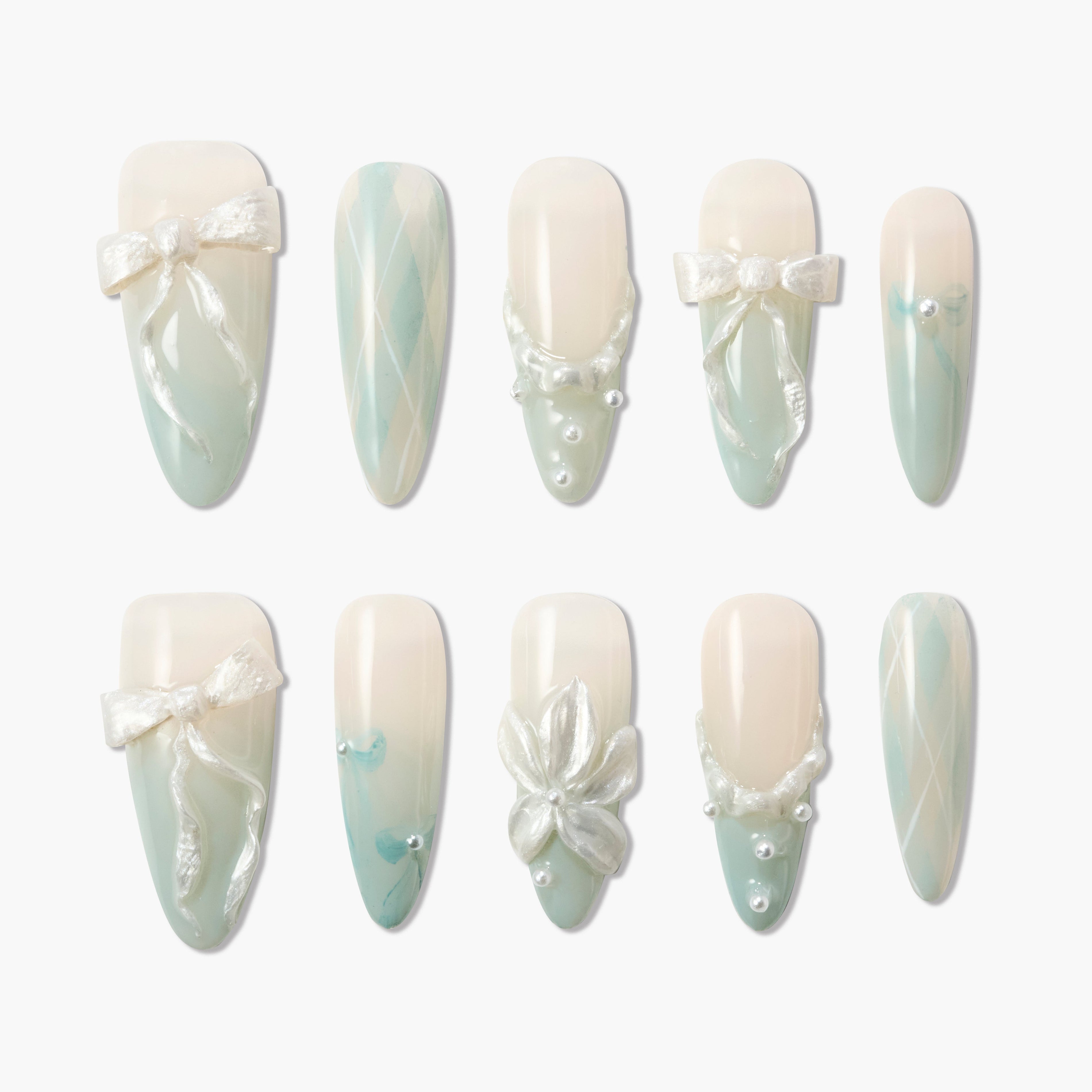 Handmade press-on nails with pastel green ombré, pearl accents, bows and 3D floral designs