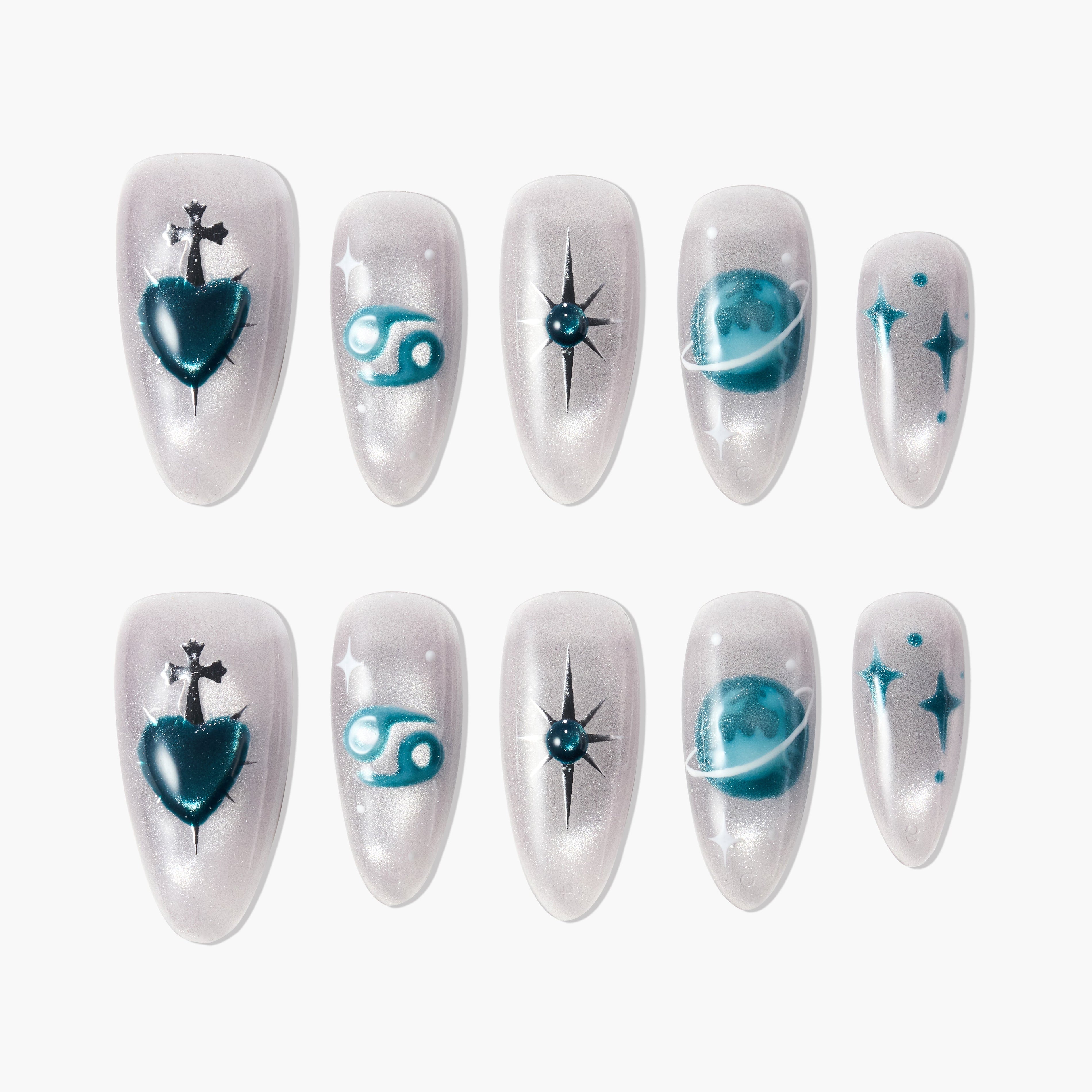 Handmade press-on nails with teal zodiac and celestial designs on pearlescent background