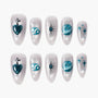 Handmade press-on nails with teal zodiac and celestial designs on pearlescent background