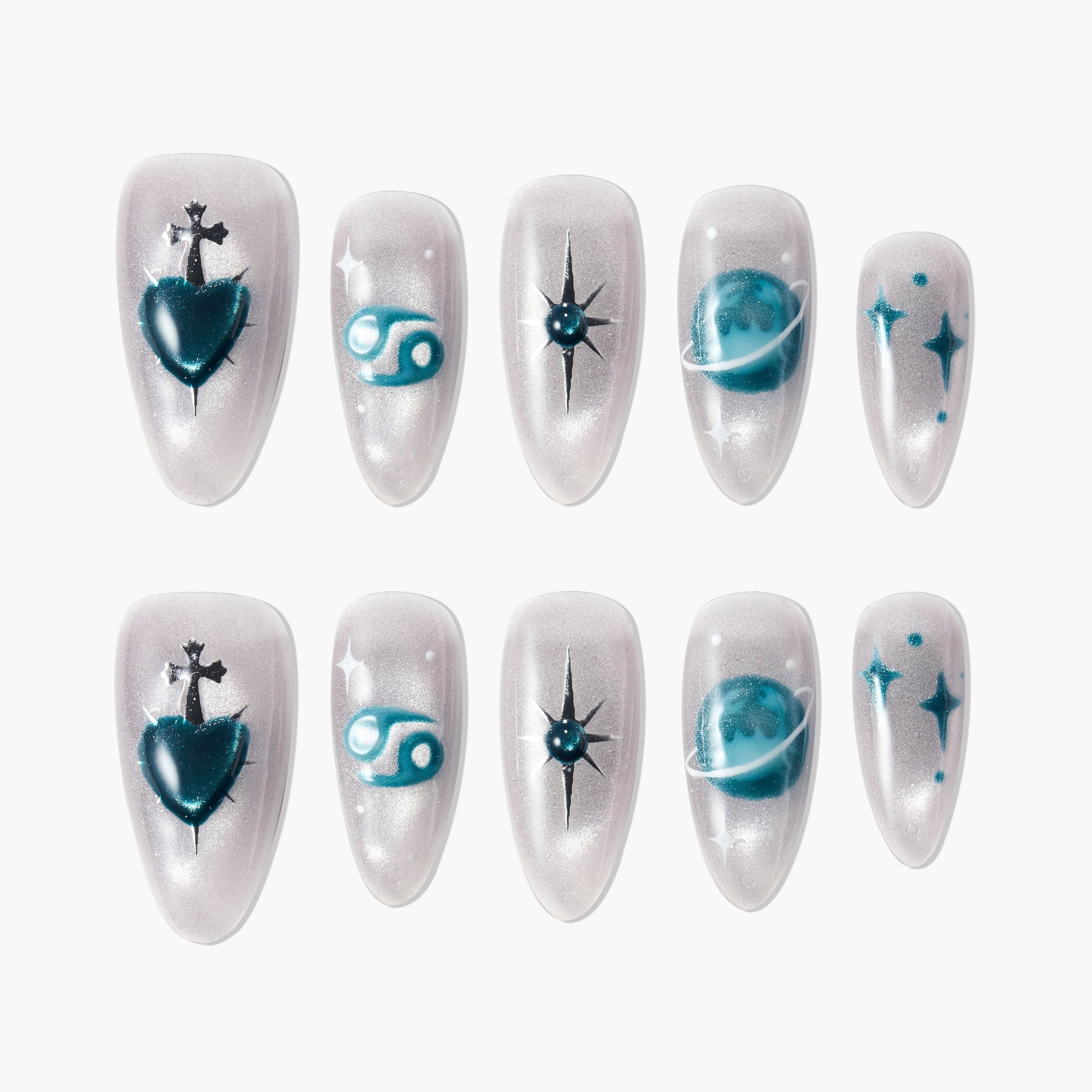 Handmade press-on nails with teal zodiac and celestial designs on pearlescent background
