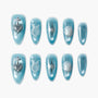 Blue press-on nails with silver 3D heart, cross, starburst, pearl, and swirl accents