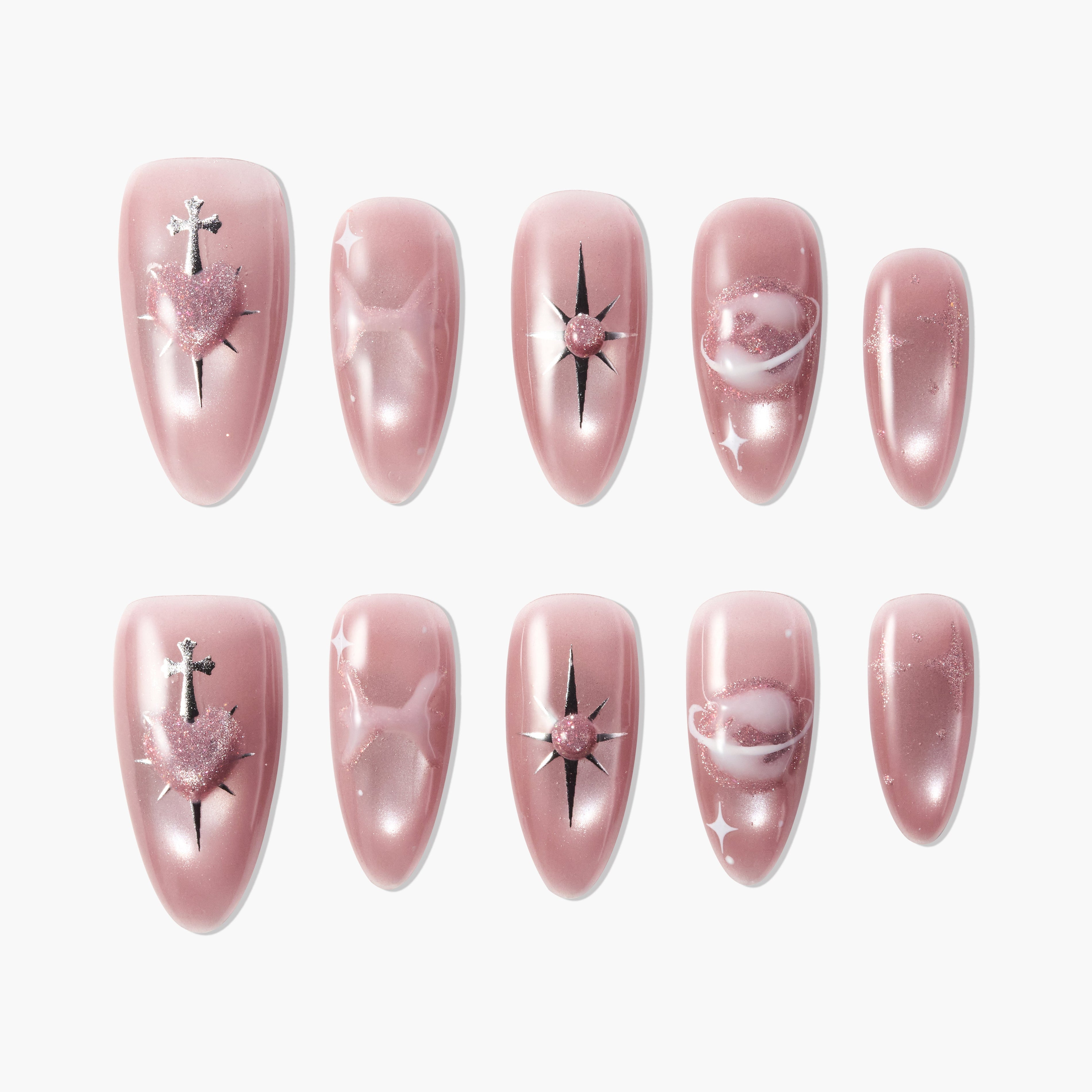 Pink handmade press-on nails with celestial, heart, and star designs, glossy finish