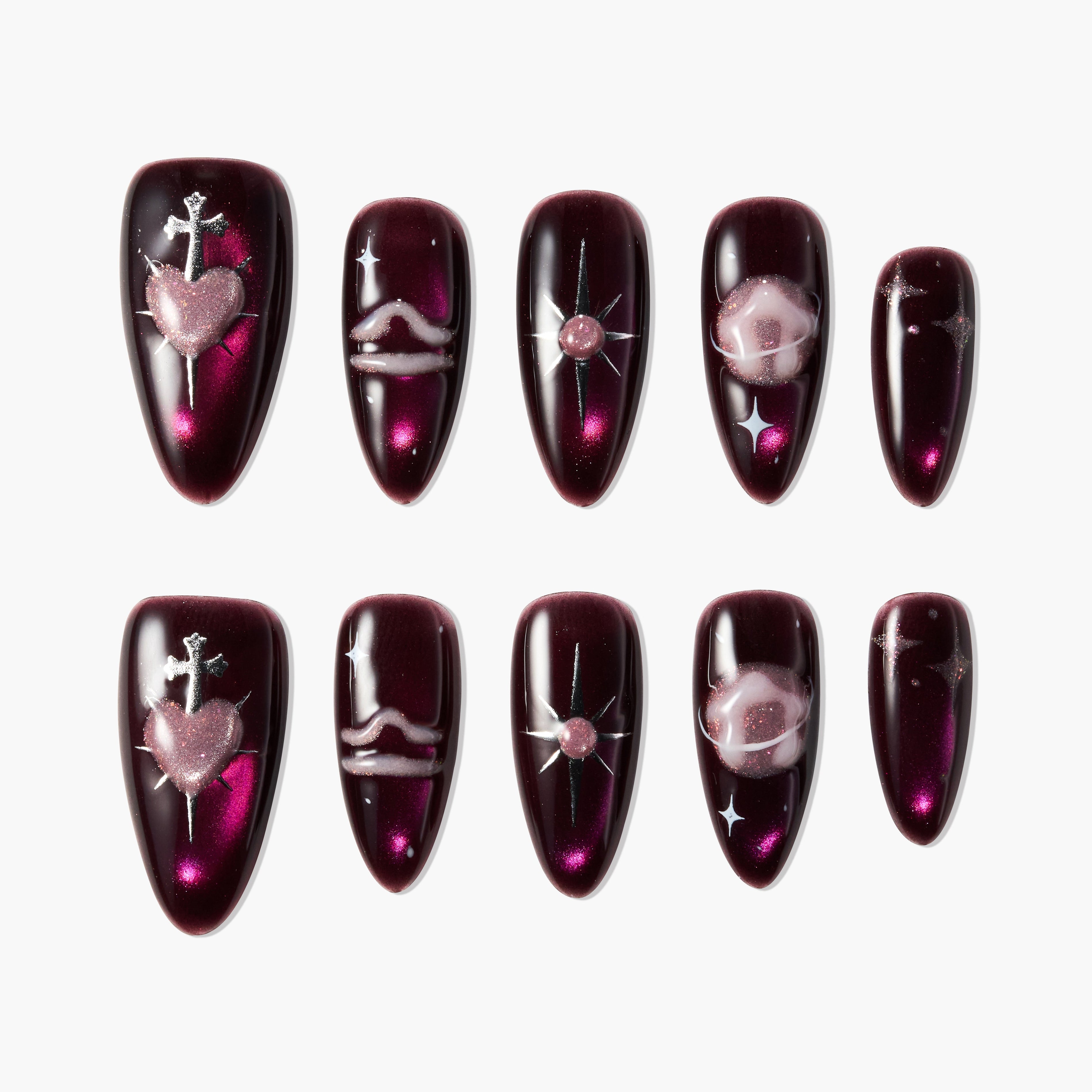 Burgundy press-on nails with metallic heart, star, and swirl galaxy designs, set of ten.