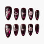 Burgundy press-on nails with metallic heart, star, and swirl galaxy designs, set of ten.