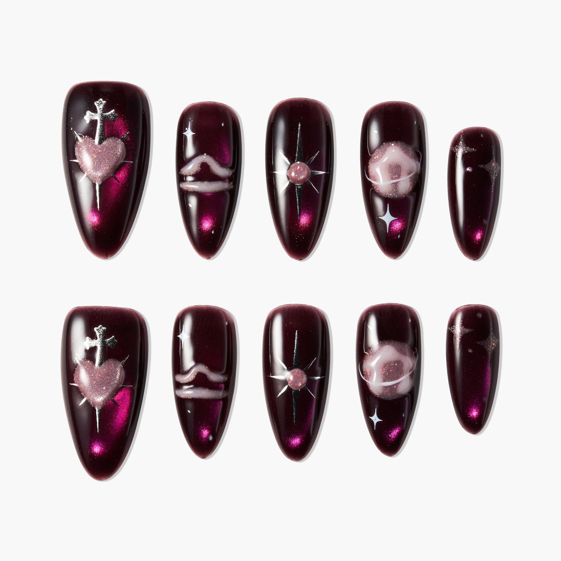 Burgundy press-on nails with metallic heart, star, and swirl galaxy designs, set of ten.
