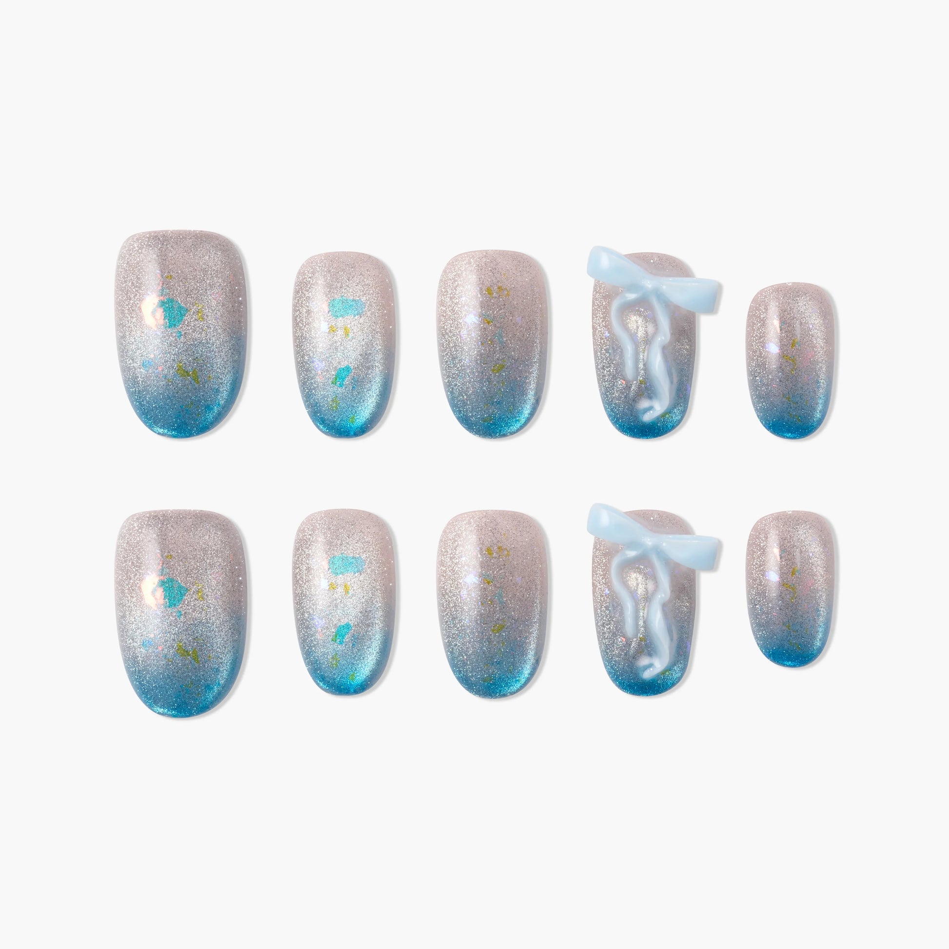 Blue ombre glitter press-on nails with 3D bow and abstract art accents, handmade design