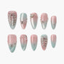 Pink and blue ombre press-on nails with rhinestones and pearl accents, elegant nail art design