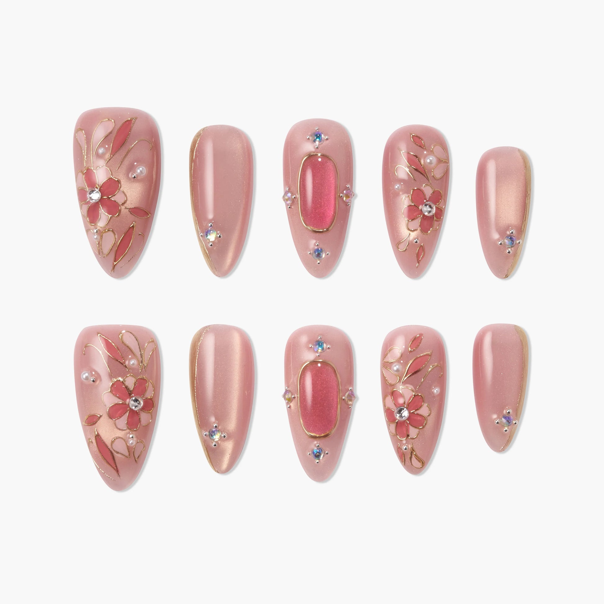 Handmade pink press-on nails with gold floral designs, crystals, and pearl accents
