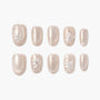Pearl beige press-on nails with 3D floral accents and crystal embellishments, glossy finish