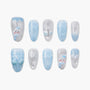Handmade press-on nails with winter snowman, snowflake, and light blue holiday designs