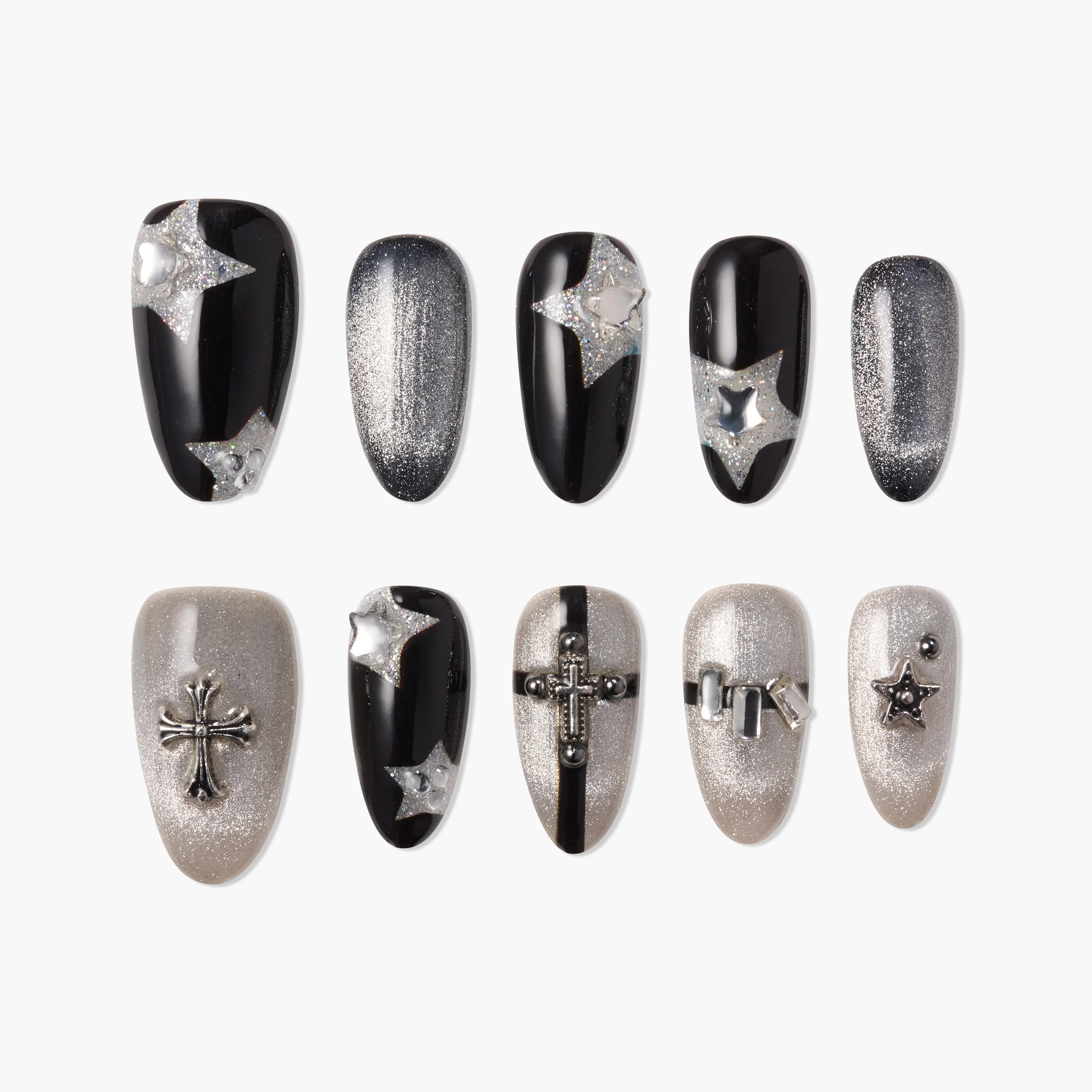 Black and silver press-on nails with 3D stars and cross charms, glittery and bold nail art design