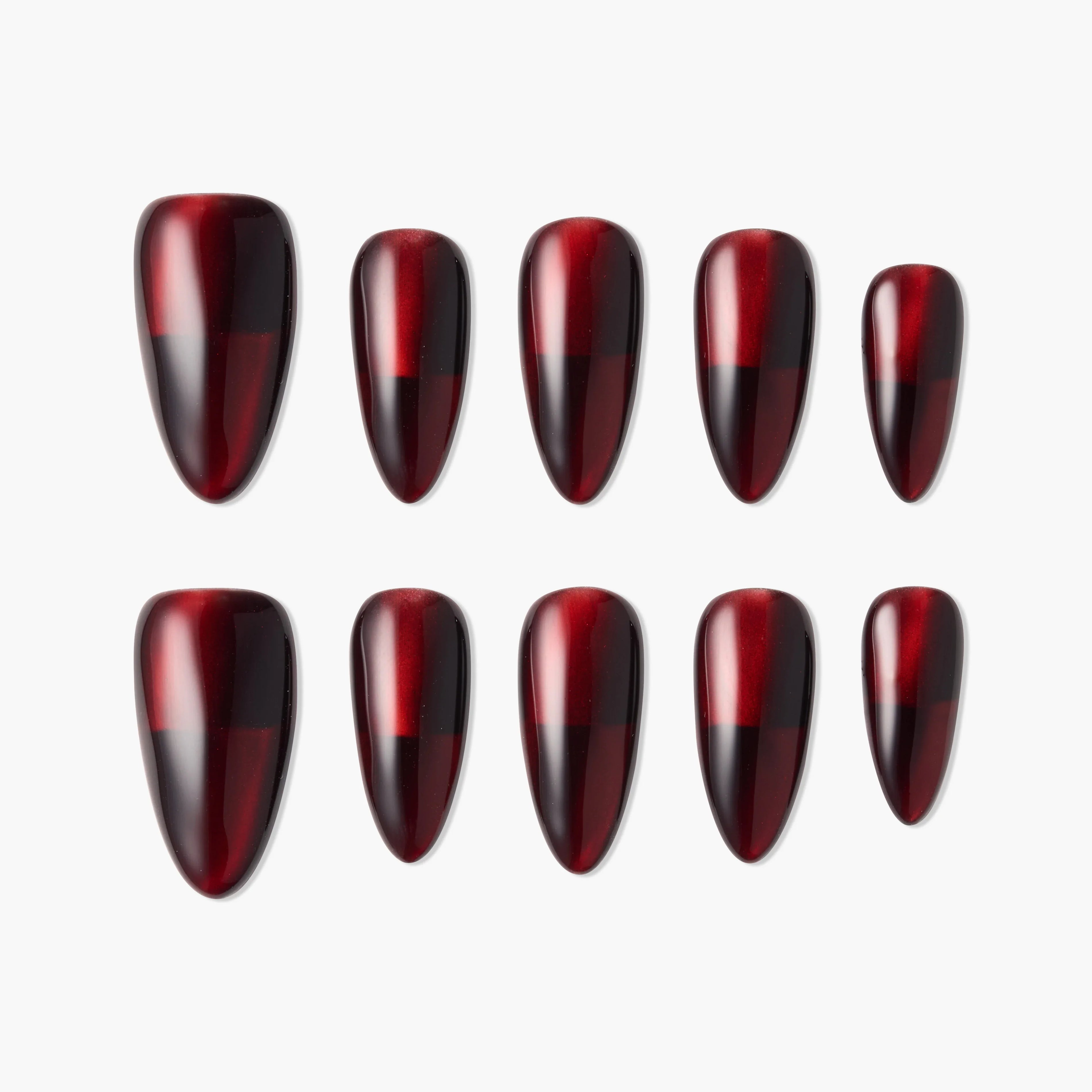 Glossy burgundy and black ombre press-on nails set on white background
