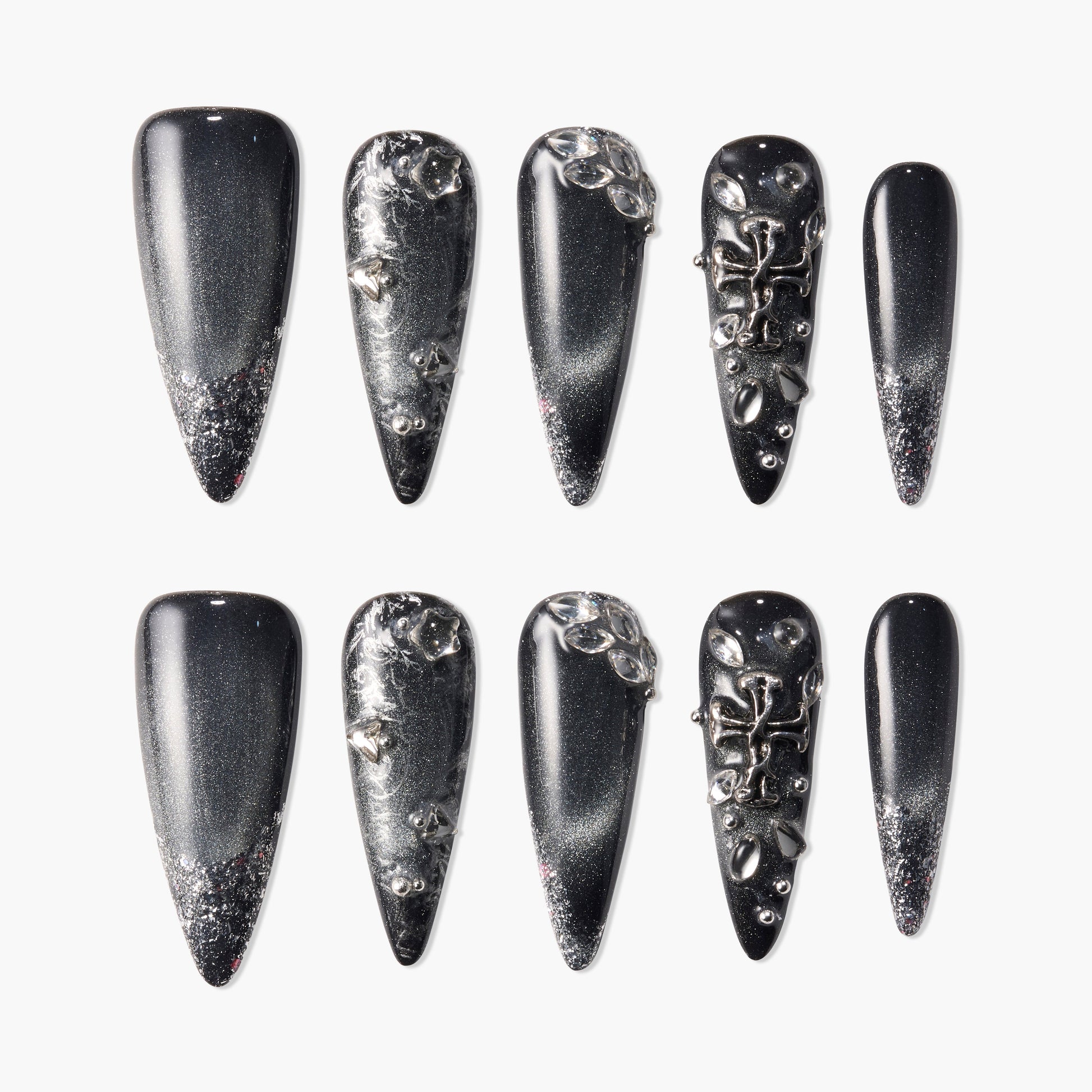 Black stiletto press-on nails with silver glitter and 3D metallic embellishments