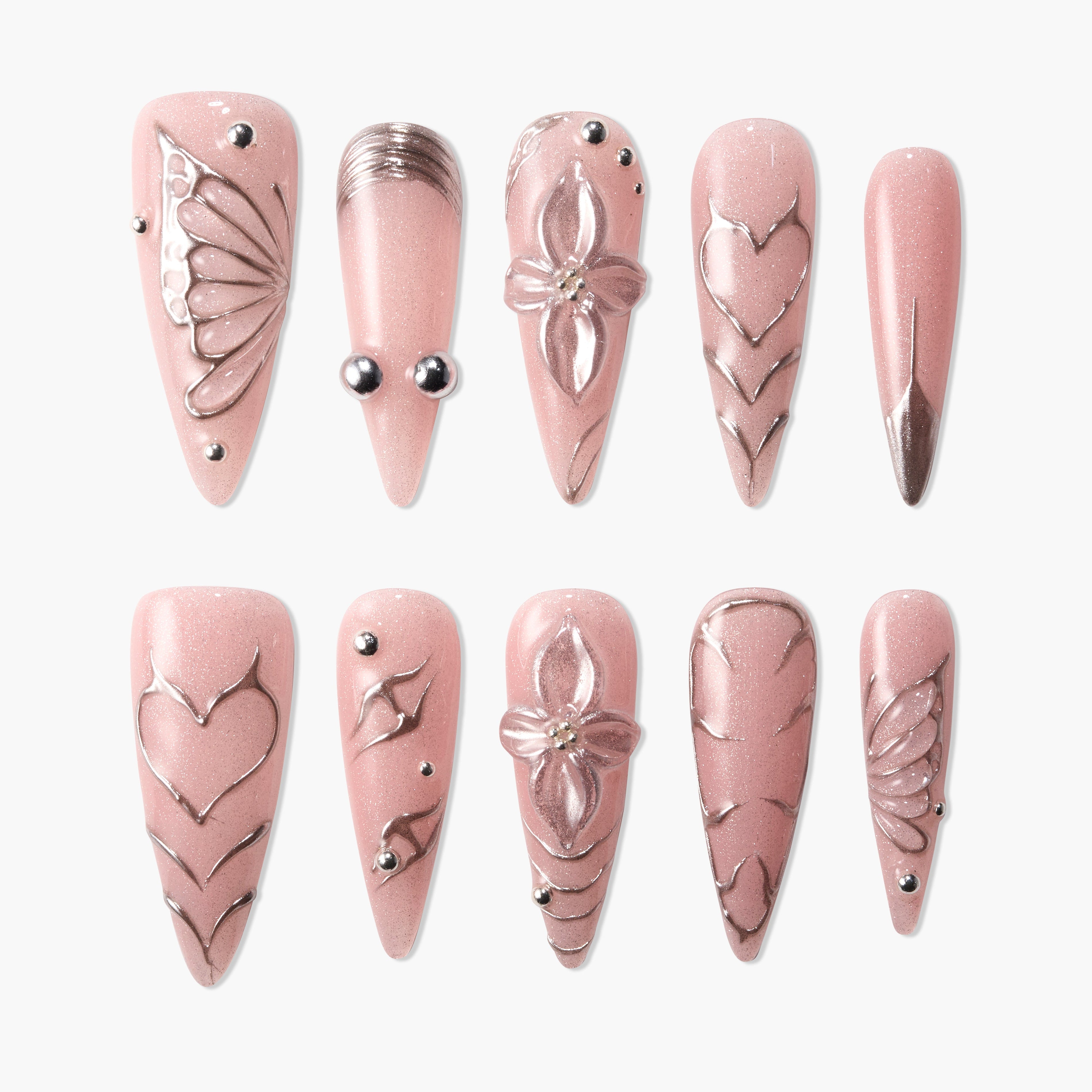 Pink press-on nails set with metallic floral, heart, and geometric embossed designs