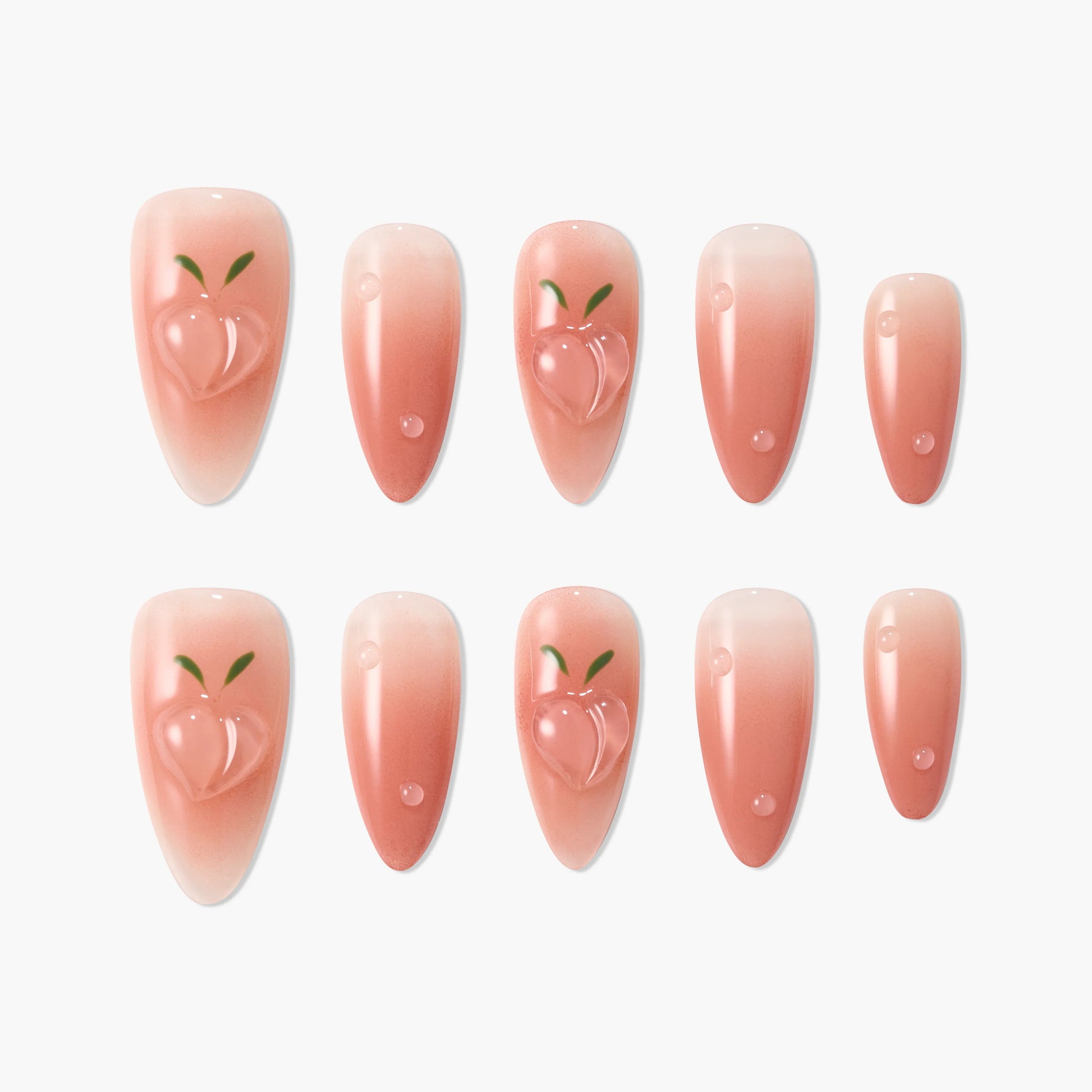 Peach design nude press-on nails with glossy finish and ombré gradient pattern