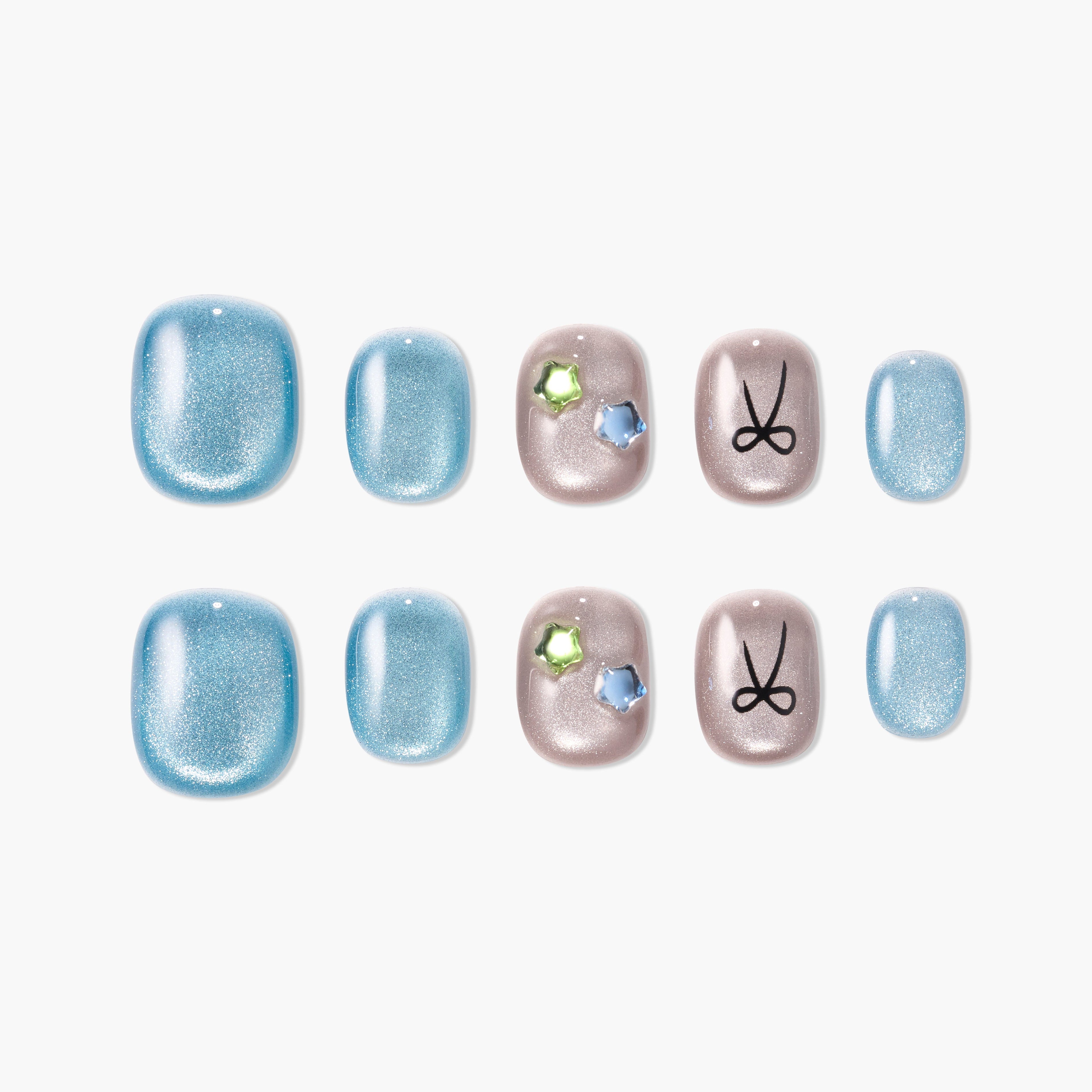 Blue and nude press-on nails set with shimmer, gem accents, and bow design