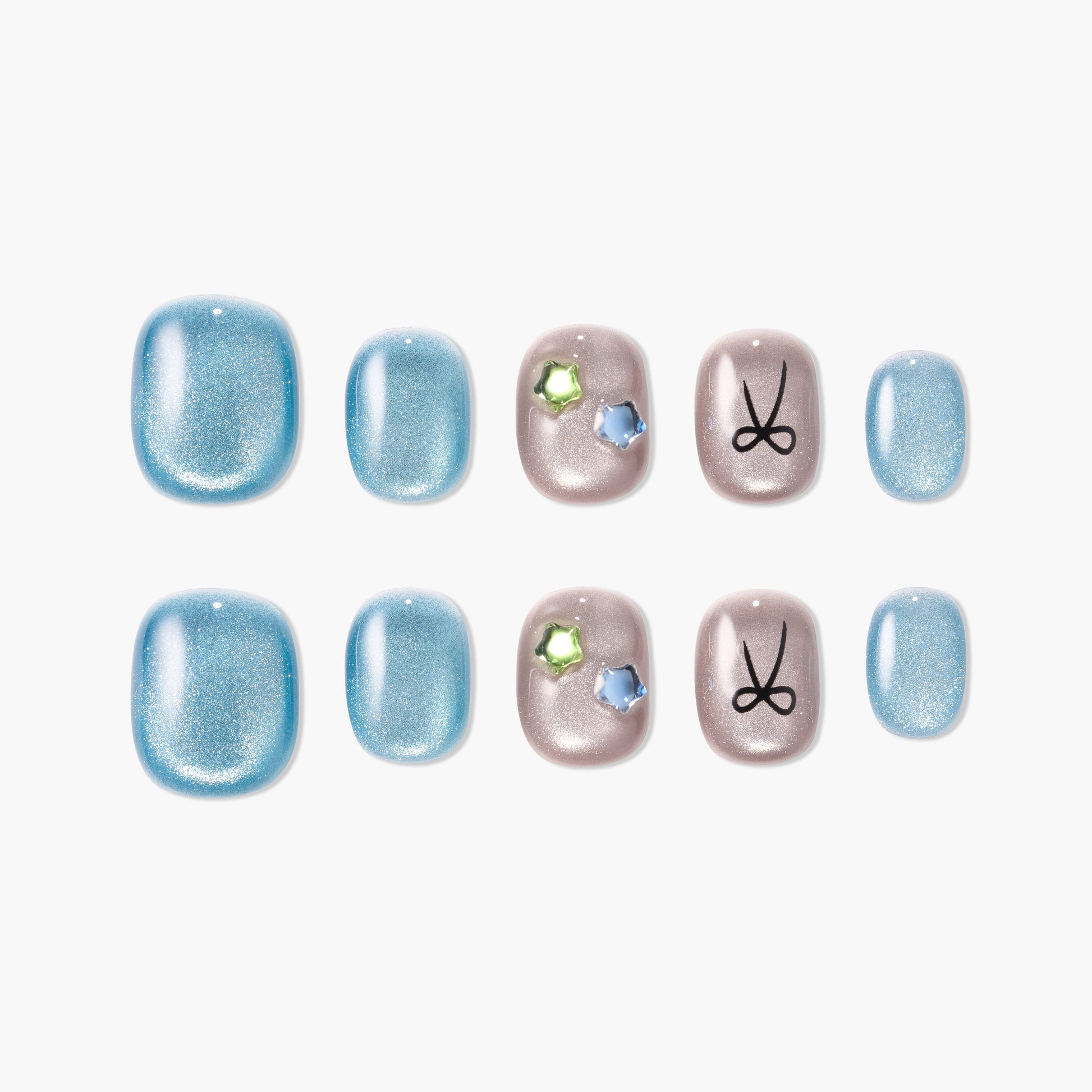 Blue and nude press-on nails set with shimmer, gem accents, and bow design