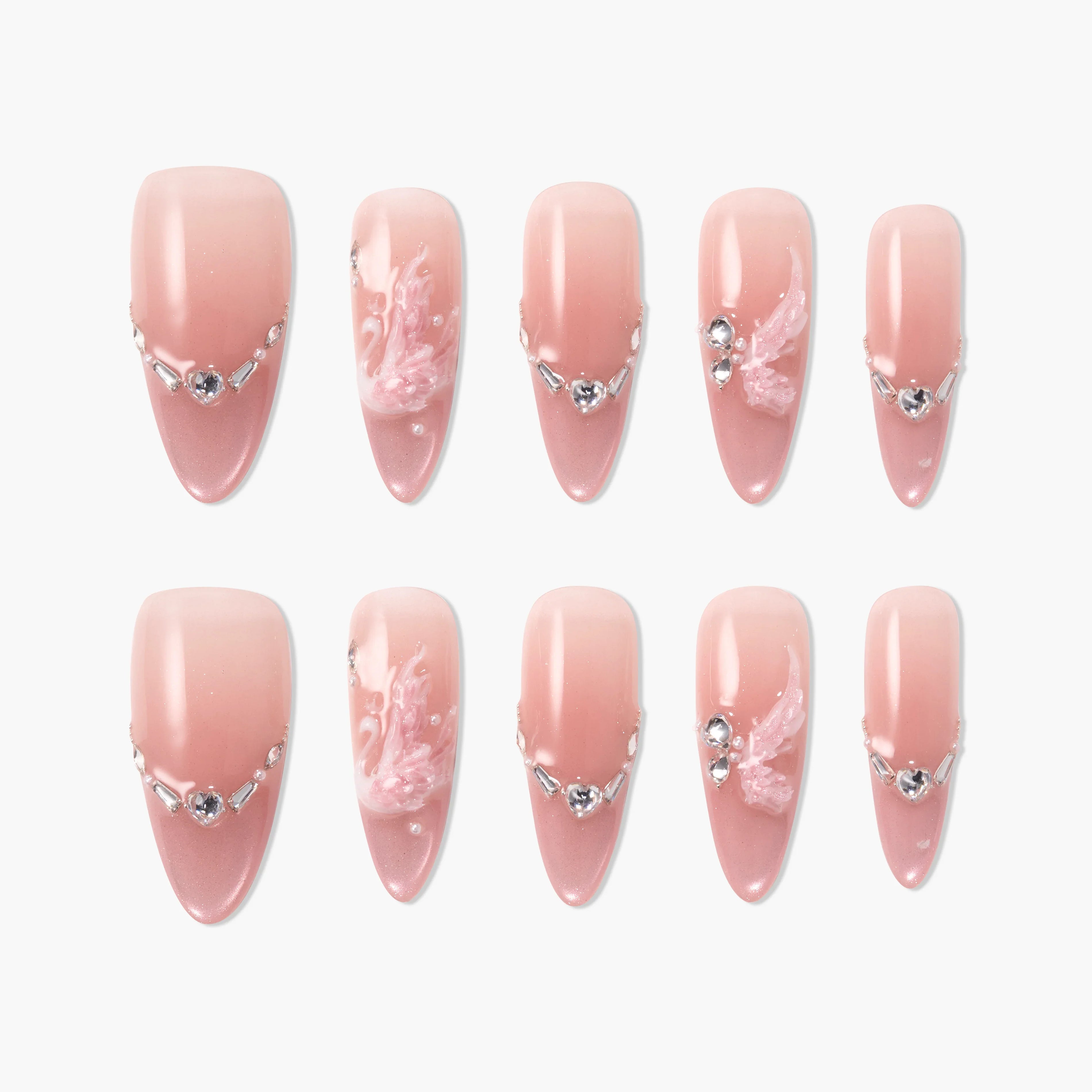 Pink ombre press-on nails with rhinestones and 3D floral accents, almond shape set.
