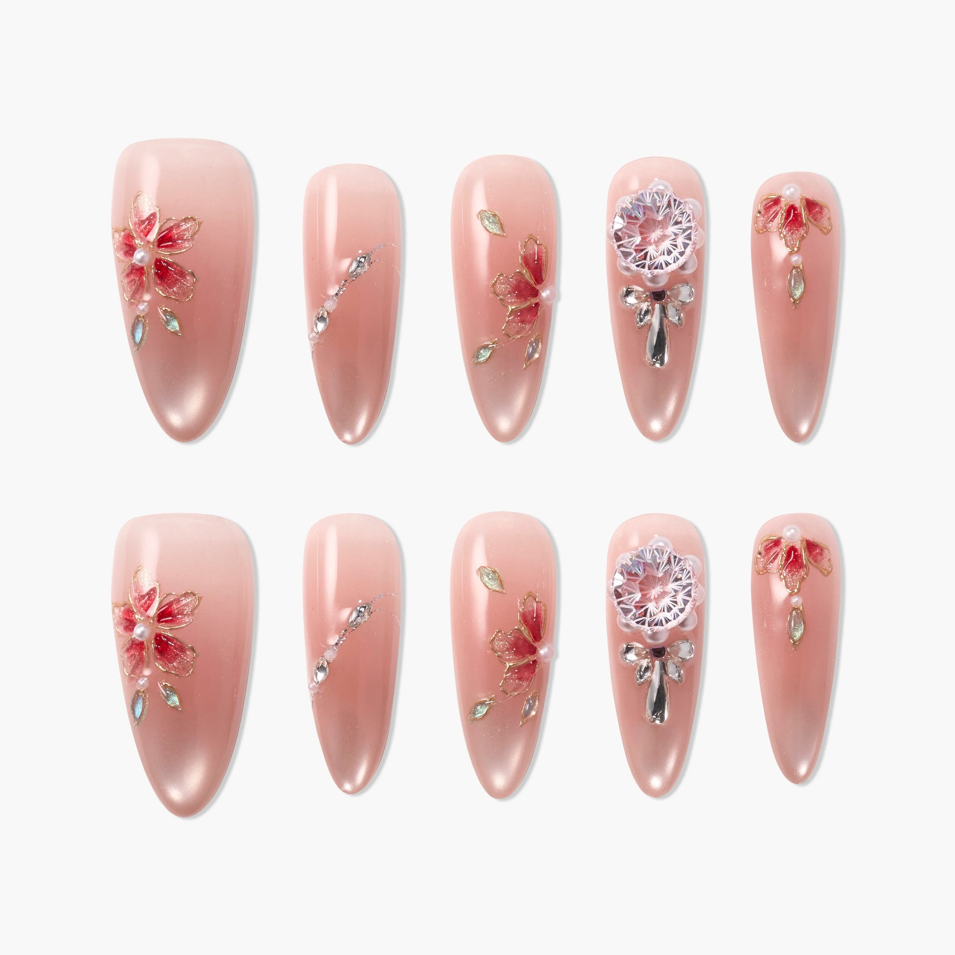 Handmade pink press-on nails with 3D floral designs, rhinestones, and jeweled accents