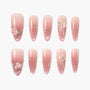 Handmade pink press-on nails with 3D floral designs, rhinestones, and glitter accents