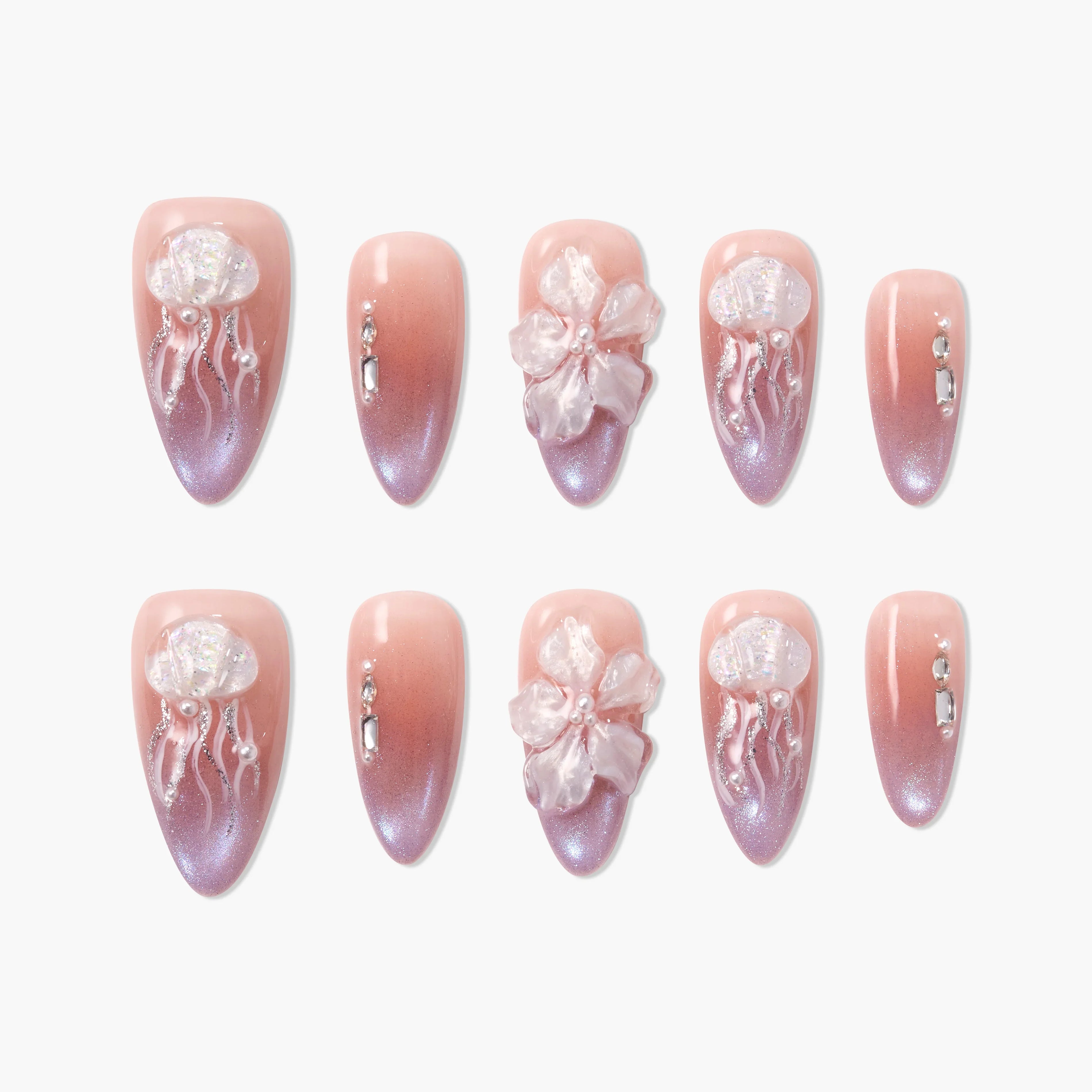 Handmade pink ombre press-on nails with 3D jellyfish, floral, and rhinestone accents
