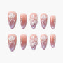 Handmade pink ombre press-on nails with 3D jellyfish, floral, and rhinestone accents