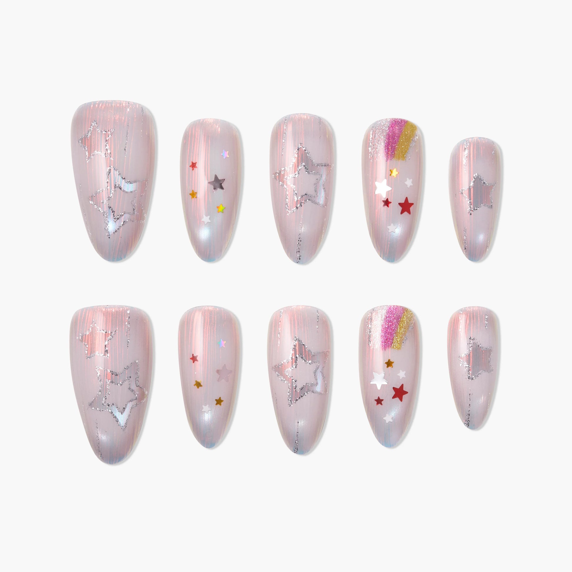 Handmade press-on nails with pink base, silver star outlines, rainbow stripes, and colorful star decals.