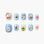 Handmade press-on nails with cute blue and white cartoon animal designs, holiday theme