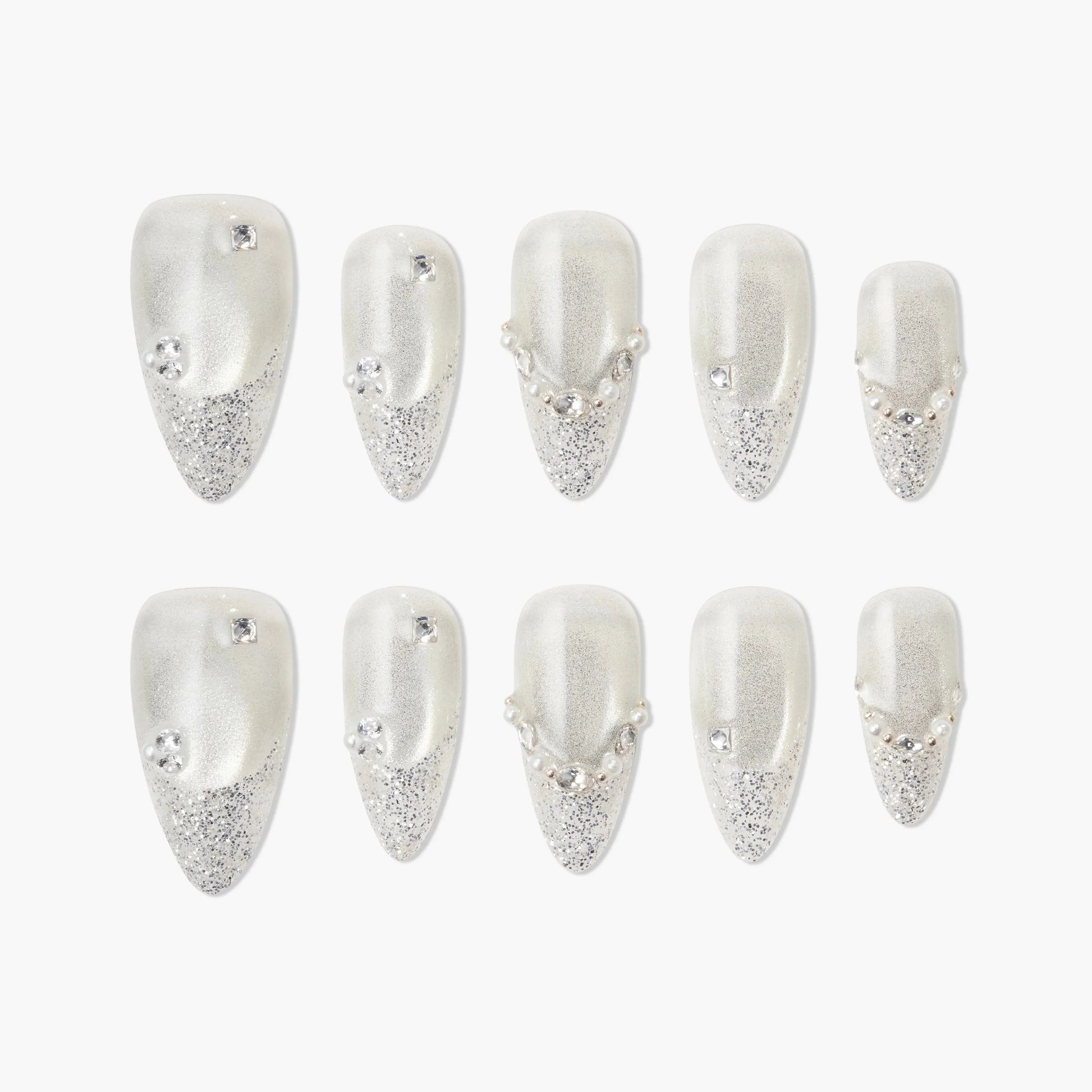 Handmade press-on nails with silver glitter tips, rhinestones, and pearl accents, elegant design
