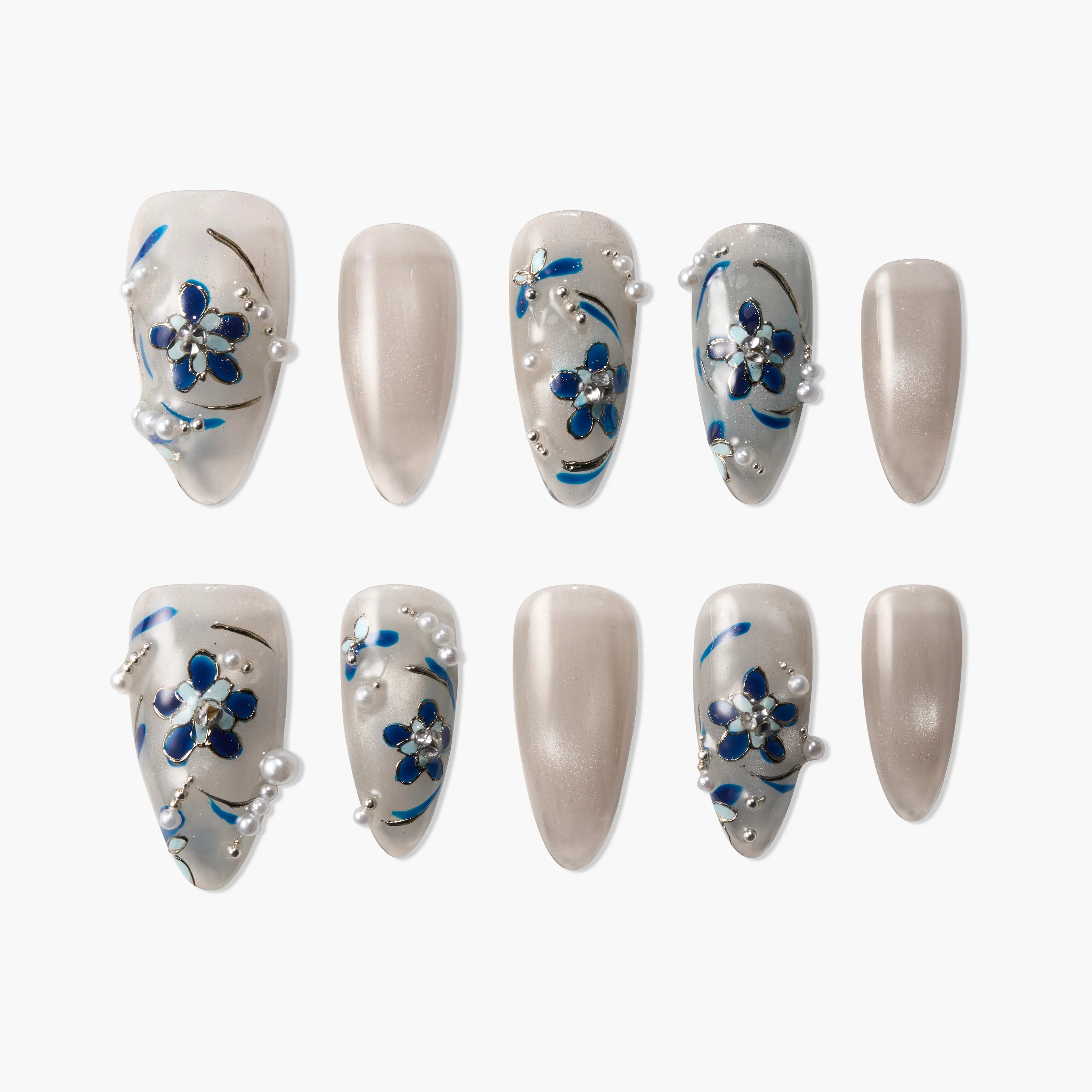 Handmade press-on nails with blue floral designs, pearl accents, and a glossy nude finish