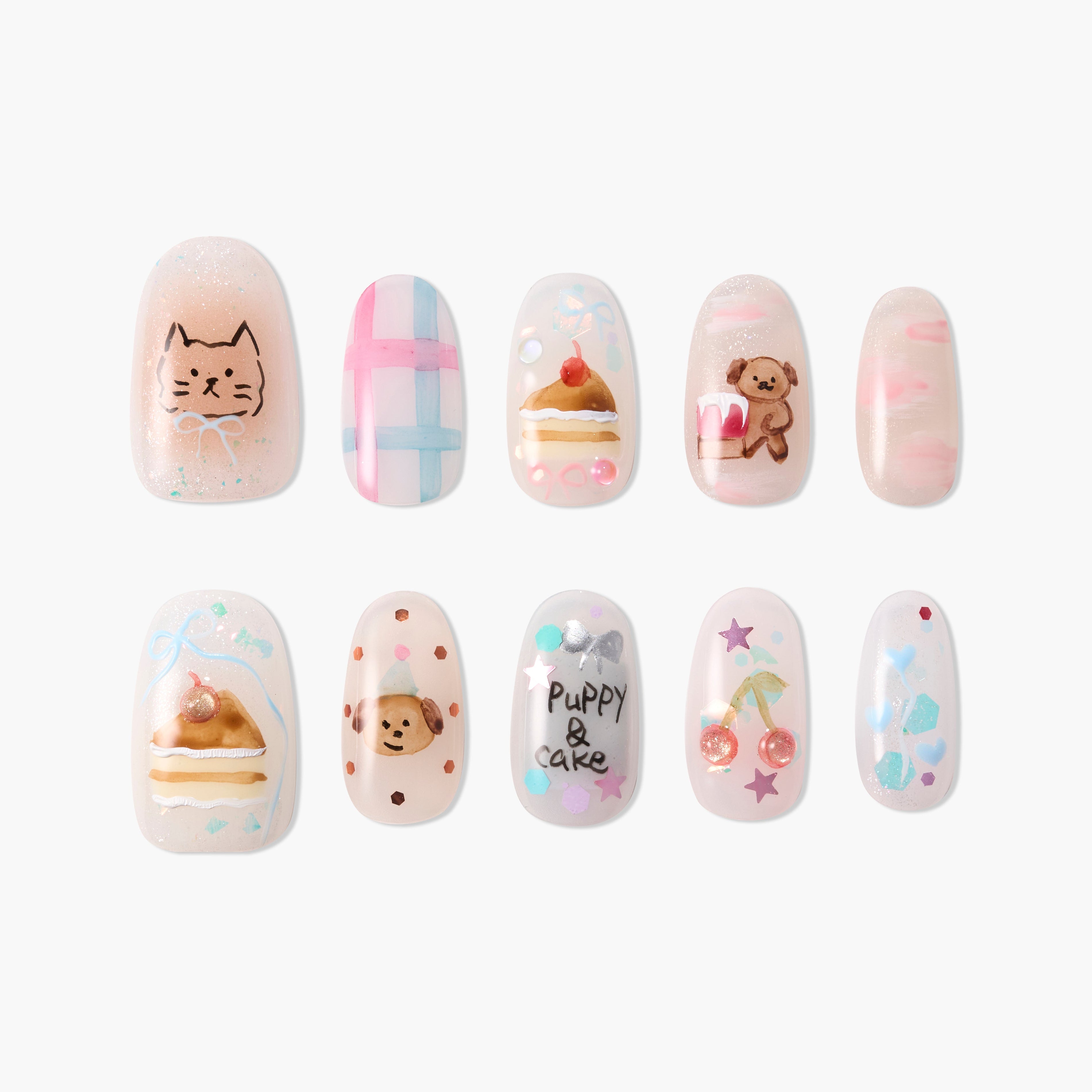 Handmade press-on nails with cute animal, cake, and pastel designs on a white background