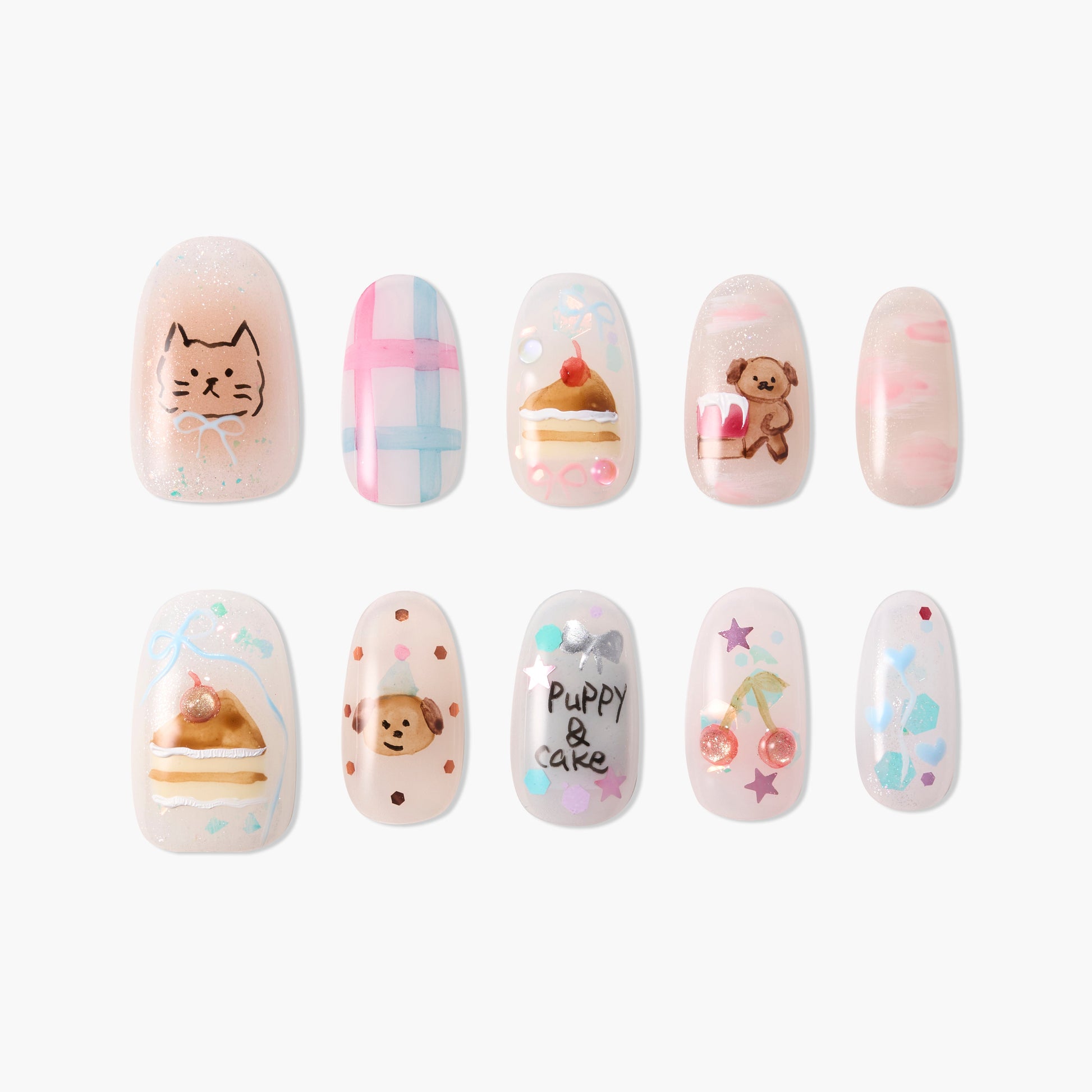 Handmade press-on nails with cute animal, cake, and pastel designs on a white background
