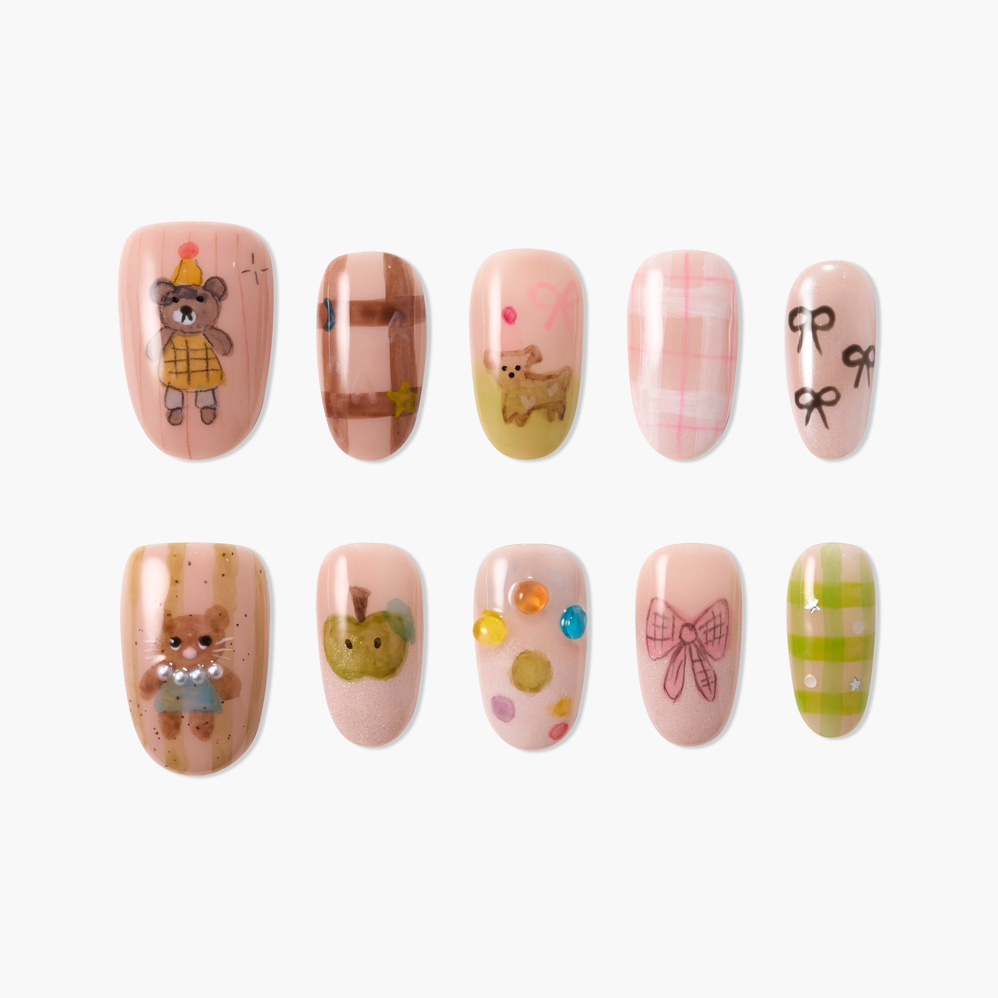 Handmade press-on nails with cute bear, bow, plaid, and gem designs on pink backgrounds.