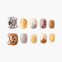 Handmade press-on nails with cartoon cat, mouse, cheese, and polka dot designs
