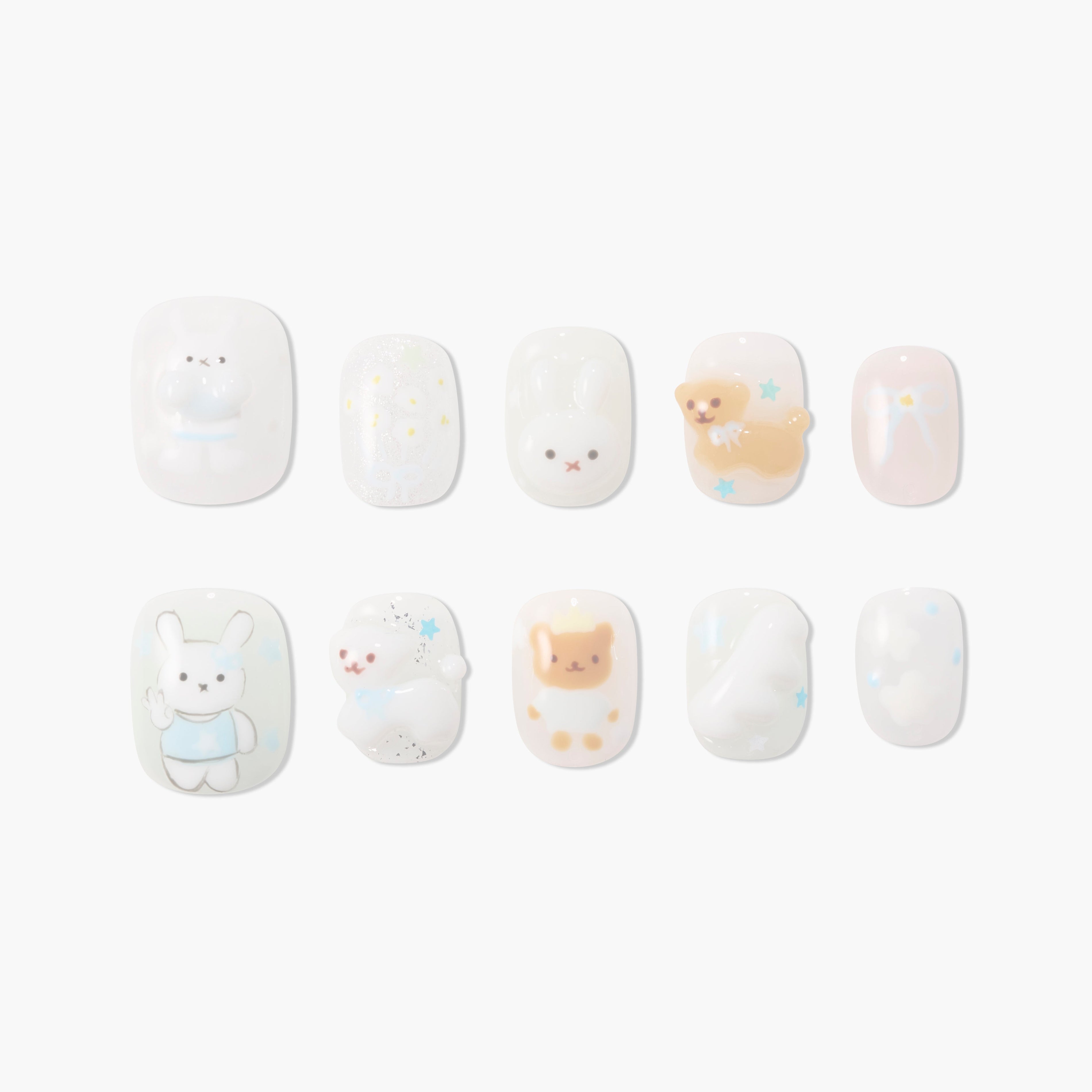 Cute handmade press-on nails with 3D bunny, bear, stars, and pastel designs on white base