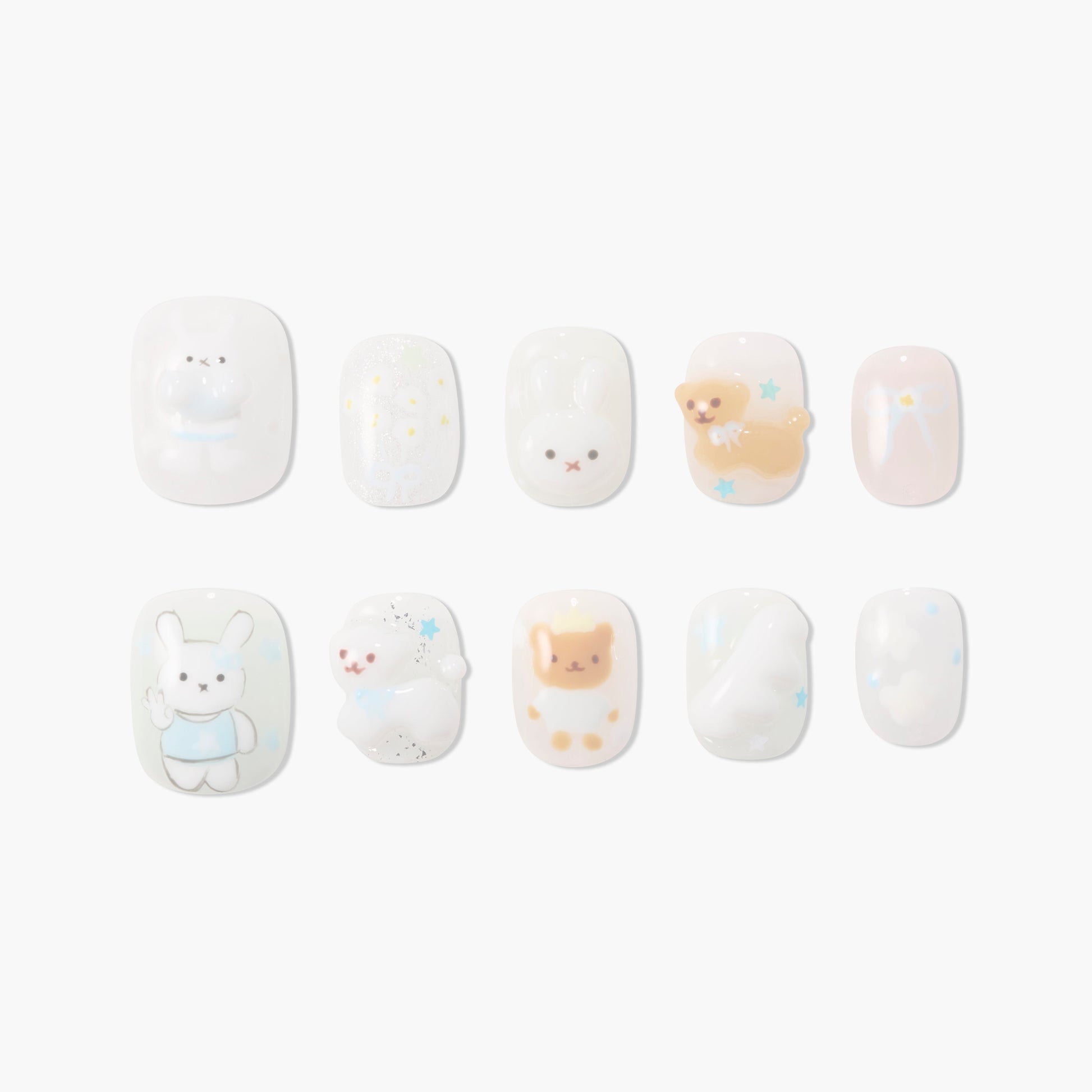Cute handmade press-on nails with 3D bunny, bear, stars, and pastel designs on white base