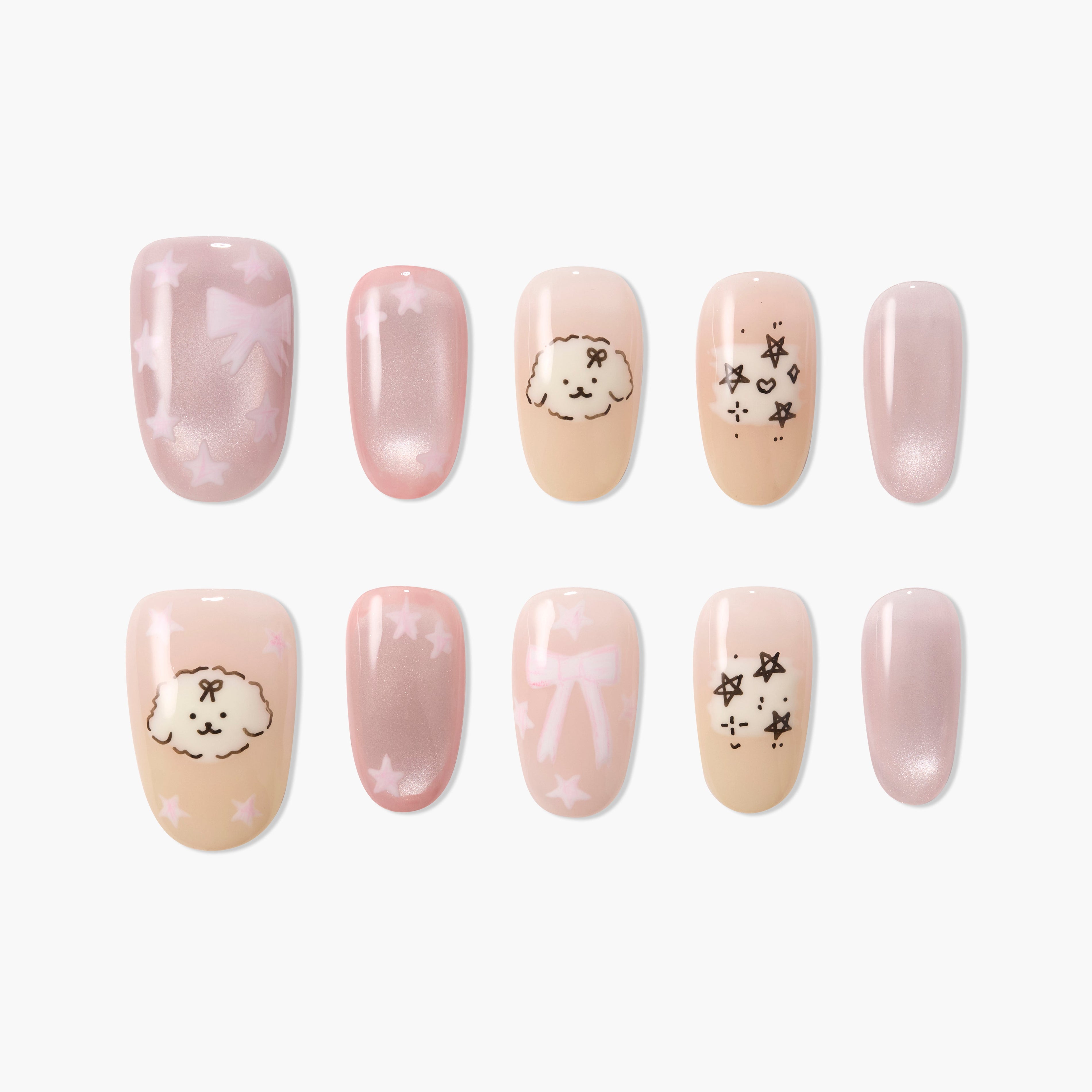 Handmade press-on nails with pastel pink designs, cute dog faces, bows, and star patterns