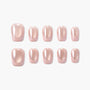 Set of glossy light pink almond-shaped press-on nails on white background